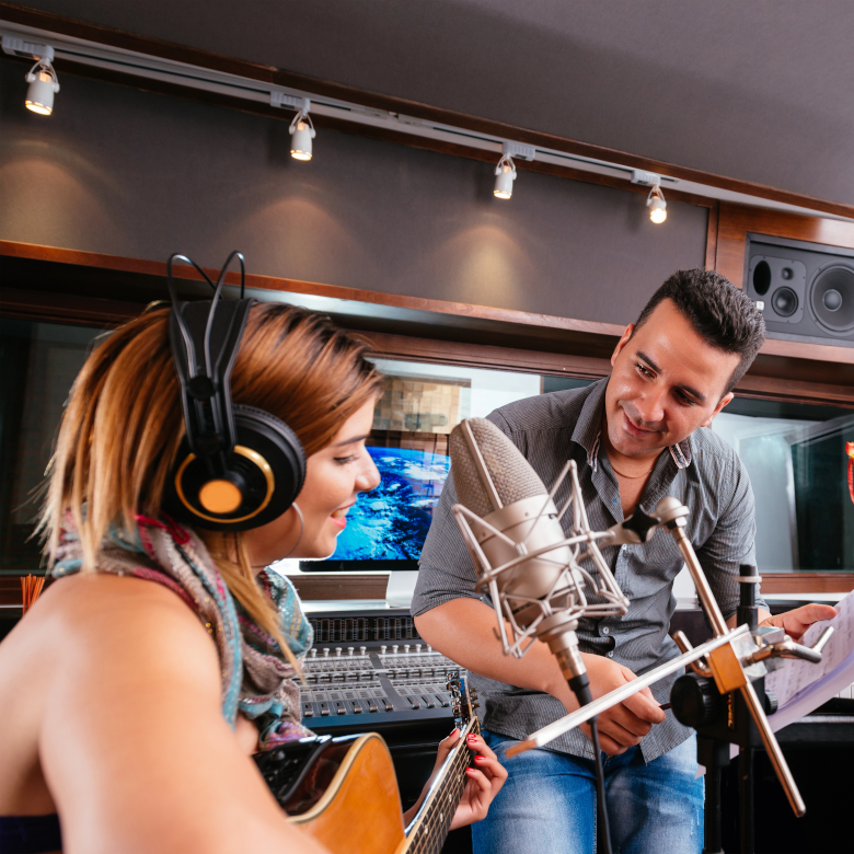 Two people working in a recording studio
