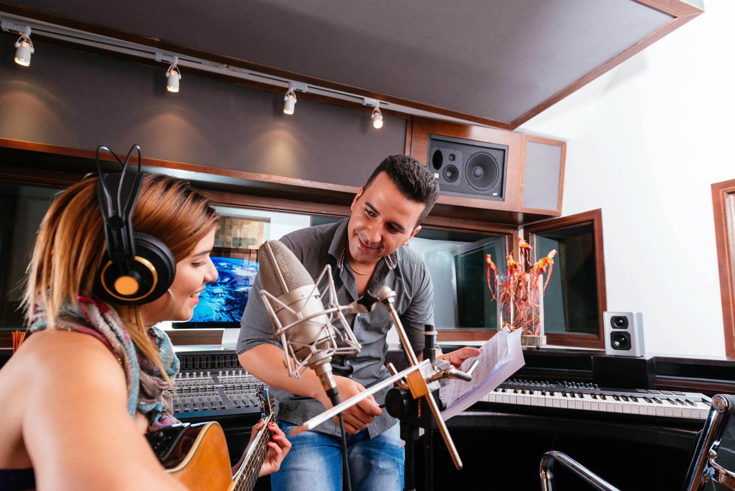 Two people working in a recording studio